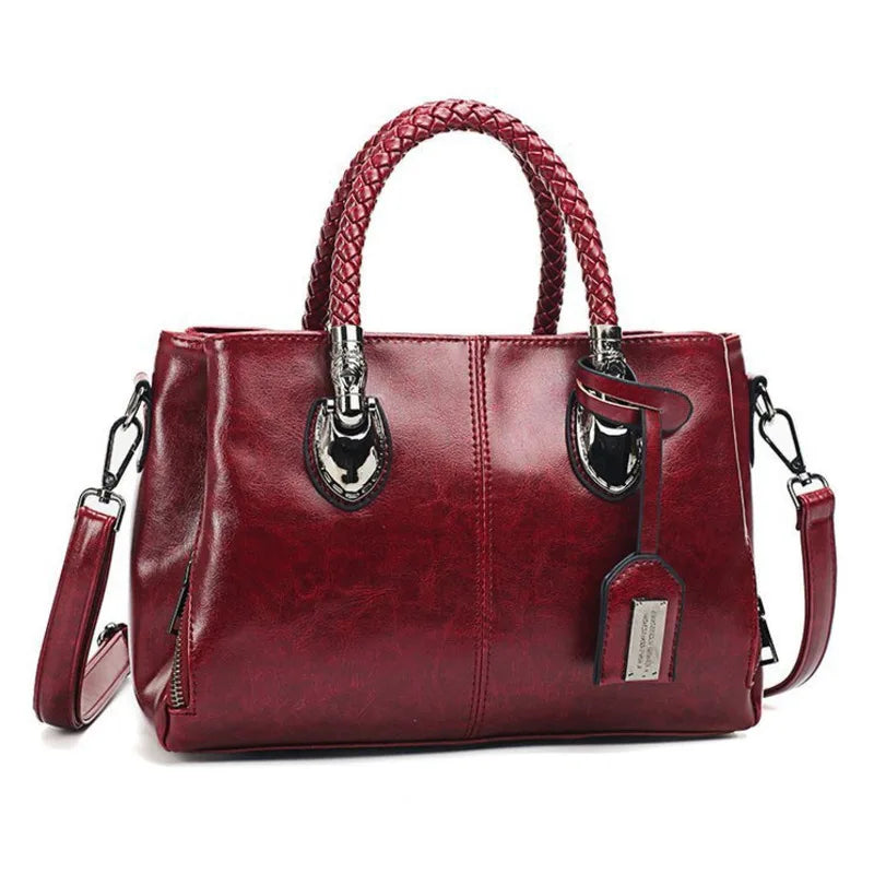 Pia | "Elegant leather handbag with braided handle".-Elly Rose